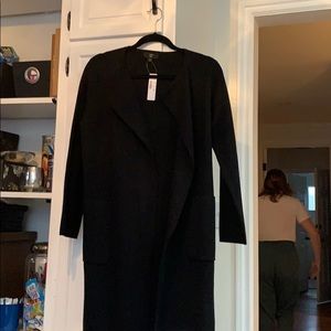 Black single breasted sweater coat.